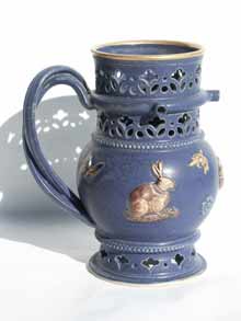 Blue and gold puzzle jug